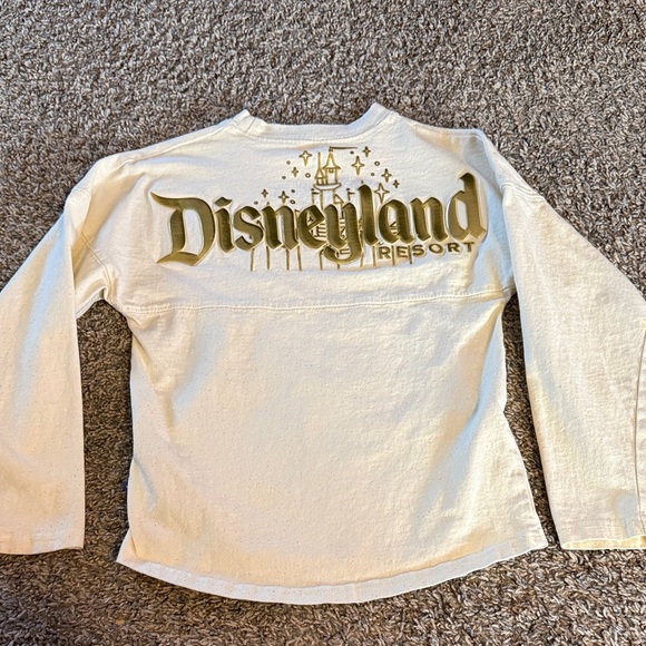Disney Other - Disney Cream Long Sleeve Tee with Gold Logo